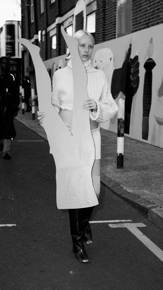 Silje Mari walking in the performance artwork / runway fashion show for Miista AW2022. Art by Cristina Reyes. Vyner Street.